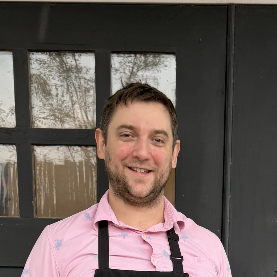 Joel Johnson, founder of Azoth Chocolate, wearing a chocolate maker's apron